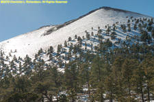 snow on black lava dome